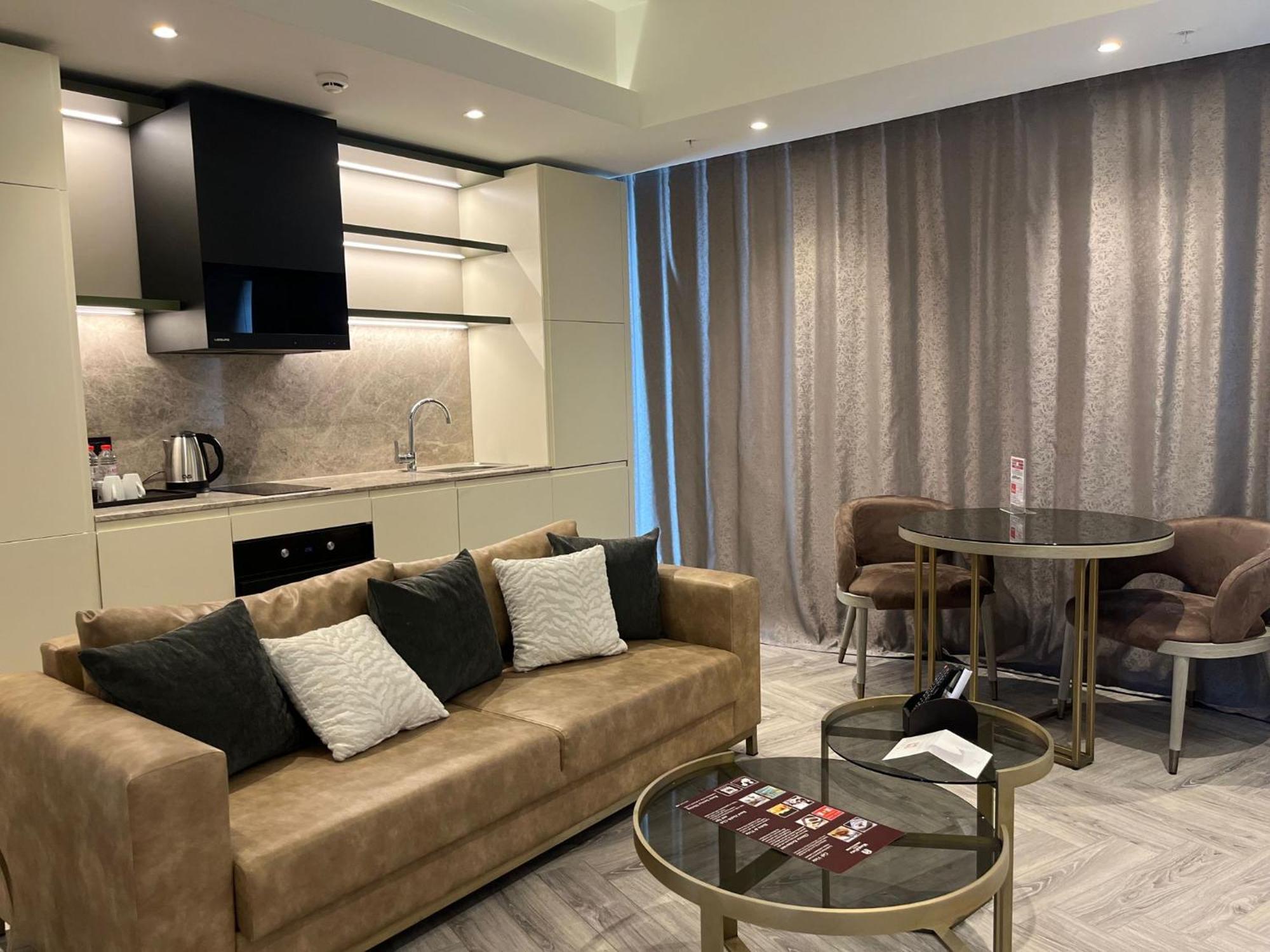 ホテル Wanda Vista イスタンブール エクステリア 写真 A living room at the hotel